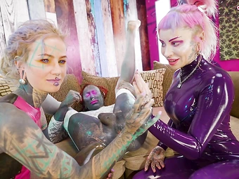 Blonde bombshell Lily Lu gets her ass fisted by two dominant lesbians in kinky latex