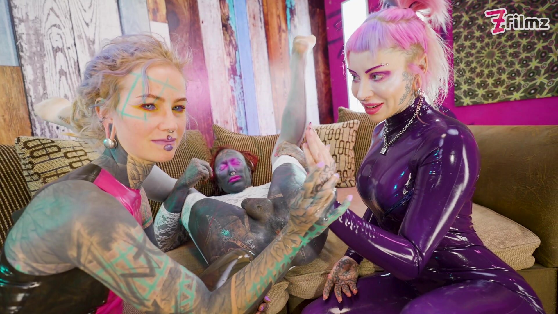 Blonde bombshell Lily Lu gets her ass fisted by two dominant lesbians in kinky latex